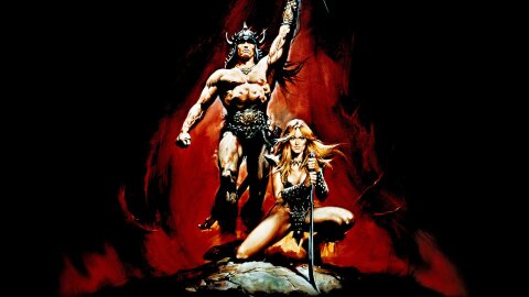 Conan the Barbarian standing triumphant with a hot 80s fantasy lady