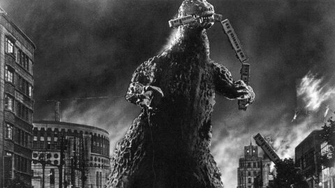 Godzilla smashing a city in Japan black & white movie backdrop