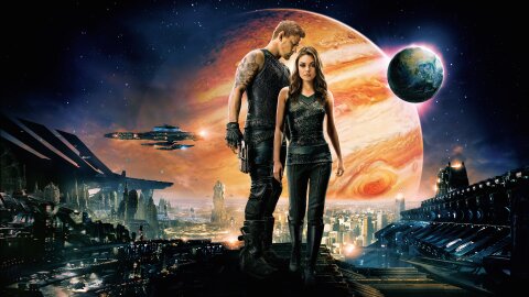 Channing Tatum and Mila Kunis standing in front of Jupiter (and Earth somehow?) movie backdrop