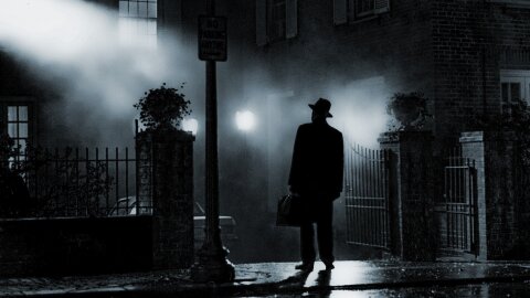 Priest standing on a misty night Exorcist movie backdrop