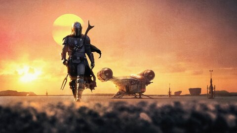 The Mandalorian walking with purpose on a desert planet