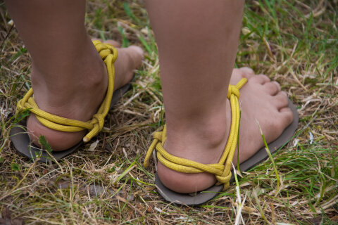 Feet wearing running sandals